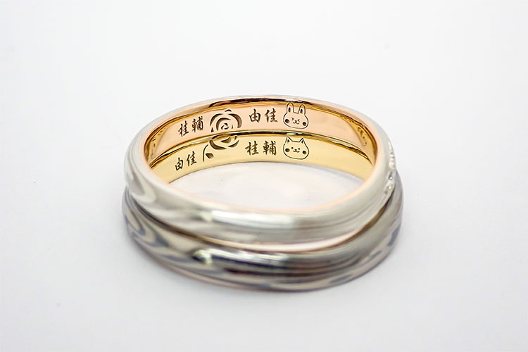 結婚指輪の内側にいれるおふたりをイメージした犬とうさぎの刻印