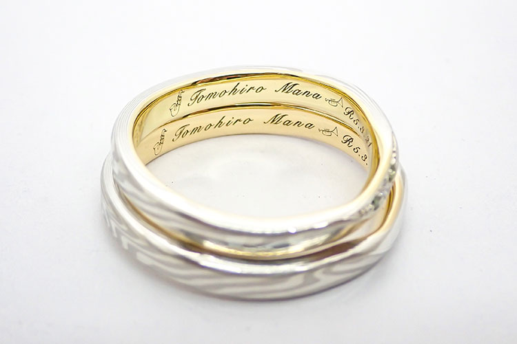 結婚指輪の内側にいれるサックスとトランペットの刻印